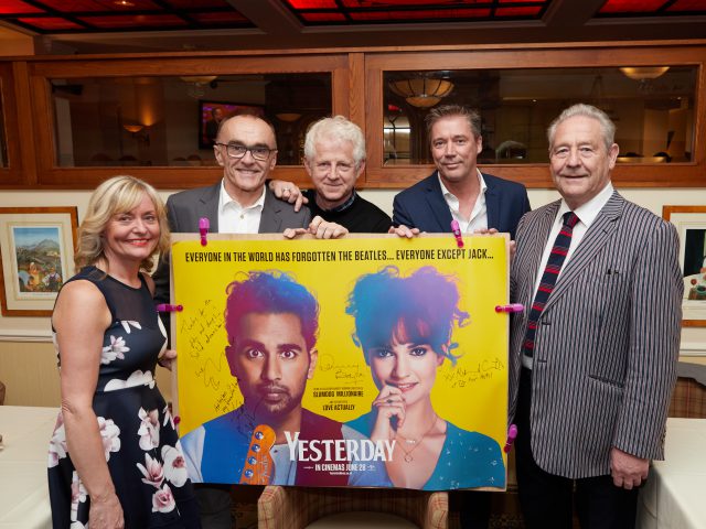 Margaret Goss, manager of the Pier Hotel, with co-owners Rodney Scott and Ian Scott, and film director Danny Boyle and scriptwriter Richard Curtis.